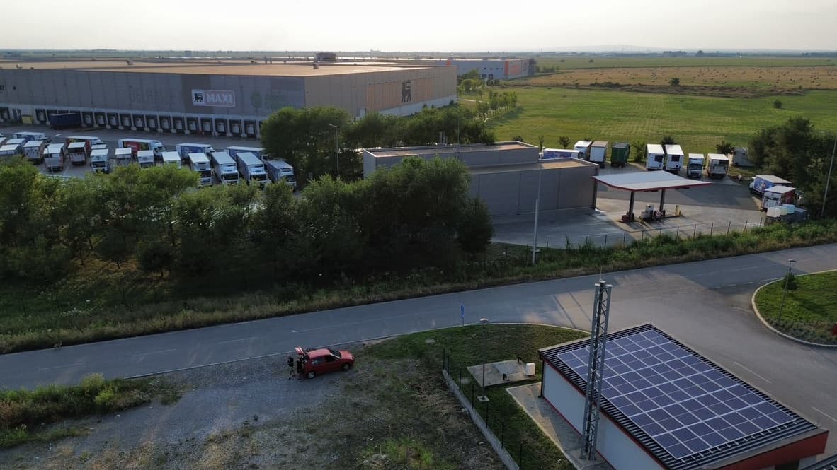 Aerial view of nearby distribution warehouses, truck parking and local industrial roads in Nova Pazova